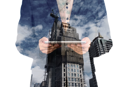 Double exposure of city and businessman on the phone as Business development concept.の写真素材