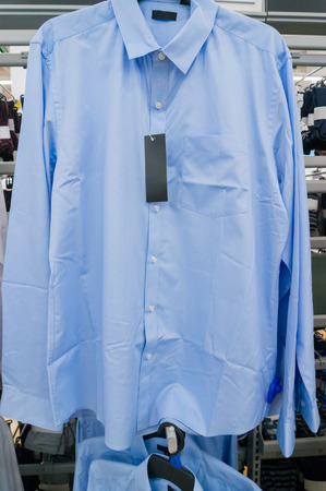 Blur Shirt on Hanger in Supermarket or Hypermarket Outlet Storeの写真素材