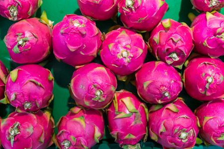 Dragon fruit on market stand, Thailand, for use as Background patternの写真素材
