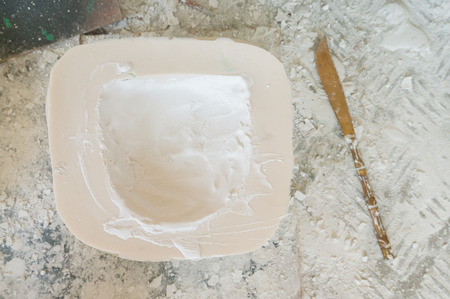 Thai Handicraft Plaster Mold on the Table with Toolの写真素材