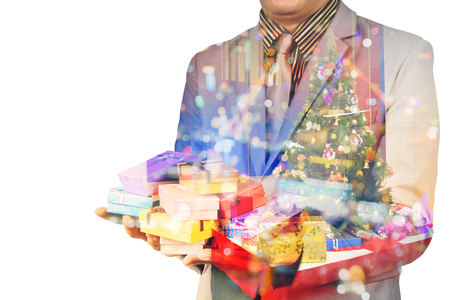 Double Exposure of Businessman with Christmas tree and Gift box or Presents as Christmas Celebration or New Yearの写真素材