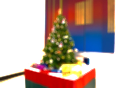 Blur Background, Light Celebration on Christmas Tree with Gift box in living roomの写真素材
