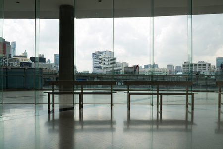 Glass Window with Scenic of Modern City Buildingの写真素材