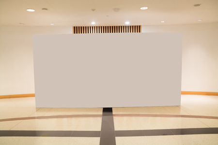 Blank white empty canvas Board hanging contemporary art museum Gallery.の写真素材