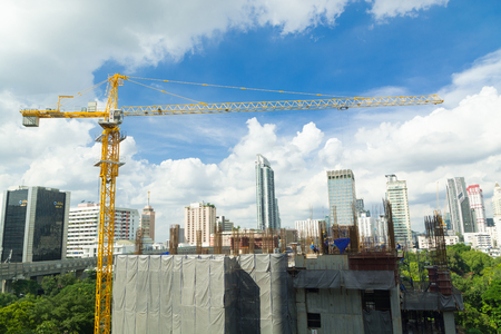 Construction Site with Tower Crane and Scenic Modern City Buildingのeditorial素材