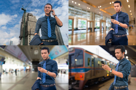 Asian Businessman use Mobile Smartphone at Construction site, Office Building, Train Station or Railway Station, Subway or Mass Transite Station as Business Technology Concept.の写真素材
