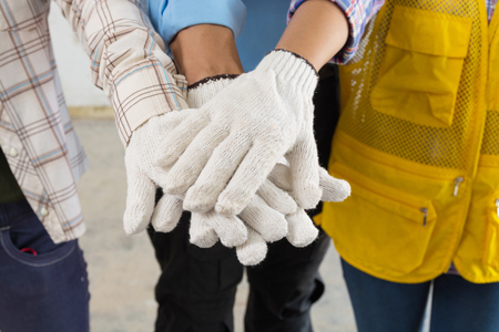 Construction Team Handshake or Join Hand of People in Real Estate Project Development as Teamwork Collaboration or United together by Multiethnic Diverse Group Worker Conceptの写真素材
