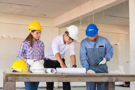 Multiethnic Business Team Engineer Diverse Group working or Discussing with Team Leader and Colleague to Finish Construction project.の写真素材