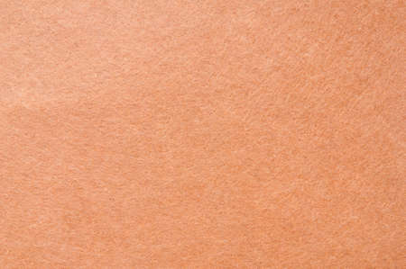 Texture background of Light Brown velvet or Orange flannel Fabric as backdrop or wallpaper pattern for decorationの写真素材