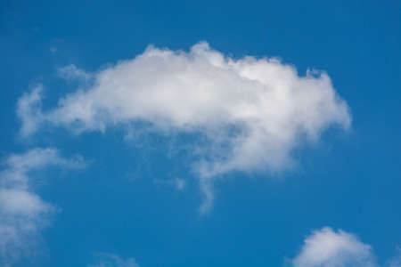 Blue Sky with White Fluffy Cloud as Nature Backgrond