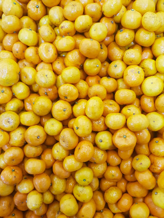 Background Pattern of Small Mandarin Orange or Lemon as Natural Fruit or Vitamin C Concept.の写真素材