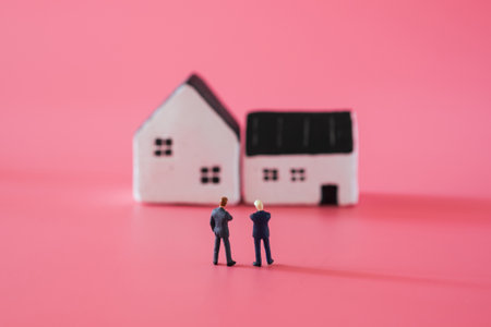 word from wooden blocks âsafeâ with mini model home on pink background in staying at home concept.の写真素材