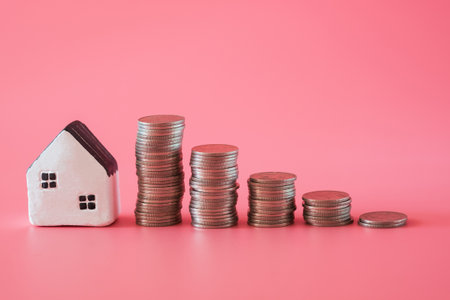 word from wooden blocks âsafeâ with mini model home on pink background in staying at home concept.の写真素材