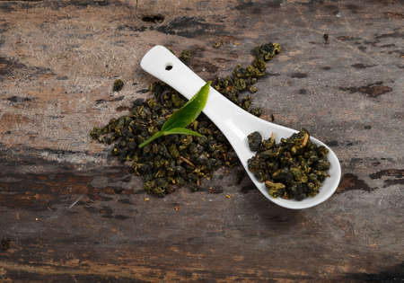Tae cup and dry leaf on a background