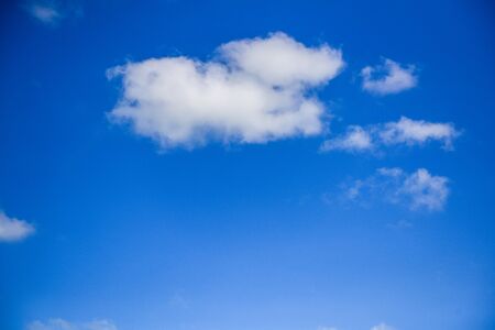 Blue sky background with partly cloudyの写真素材