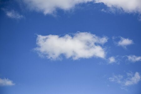 Blue sky background with tiny clouds, clouds in the blue skyの写真素材