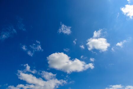 Blue sky background with tiny clouds, clouds in the blue skyの写真素材