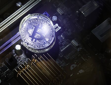 Golden and Silver Bitcoins on Electronics