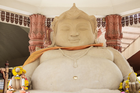 Statue of Buddha carved out of stone.の写真素材