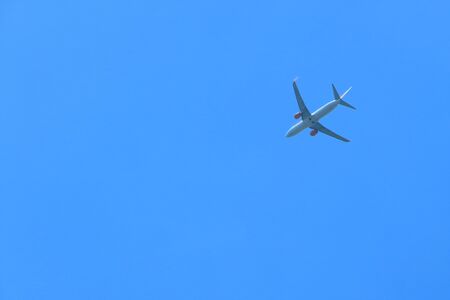 Large passenger plane in the clear blue sky.