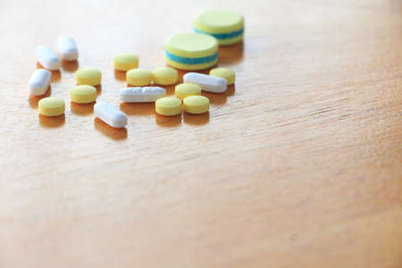 Many types of medicines on a wood table refers to health care.の写真素材
