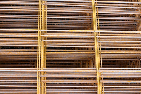 Steel bars for reinforced concrete. Closeup of Steel Bar. Geometric alignment of Re bars on construction site. Rusty is iron rustの写真素材