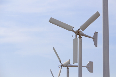 White Wind Turbines for Sustainable Power Generation and Environmentally Friendly Blue Sky and White...