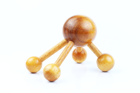 Reflexology Traditional Thai Massage tool, A wooden foot massage on a white background, isolate, wooden foot massage is a folk wisdom that Thai people. Popular Thai massage.の写真素材