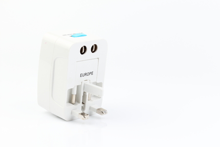 Universal travel adapter plug. isolated on white background. For travelers to many countries. Need a power adapter for electrical appliances.の写真素材