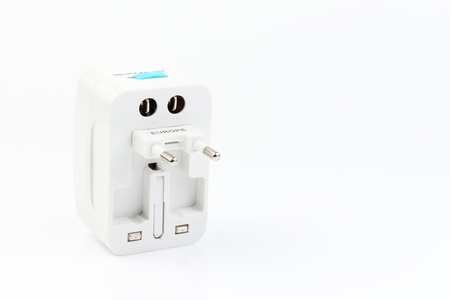 Universal travel adapter plug. isolated on white background. For travelers to many countries. Need a power adapter for electrical appliances.の写真素材
