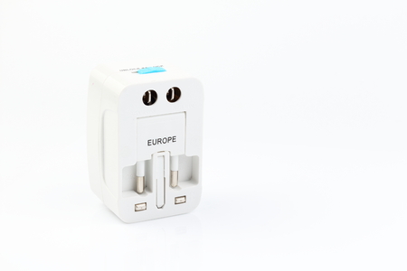 Universal travel adapter plug. isolated on white background. For travelers to many countries. Need a power adapter for electrical appliances.の写真素材