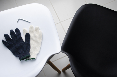 Glove on the wthie chair with ailen key. DIY Concept.の写真素材
