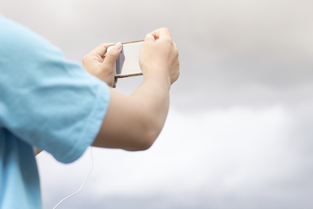 Young Woman Lifestyle Happy Using A Smartphone Outdoors , Filtered images color effect