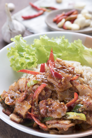 Asian Food, Spicy Bacon with brown rice and chiliesの写真素材