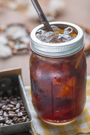 Cold arabica coffee with iced in vintage jar.の写真素材
