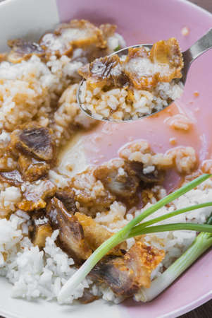 Freshly baked crispy pork eating with rice and red sauce.の写真素材
