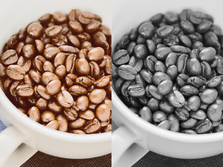 Coffee beans of arabica on texture wooden background. Photo in vintage color tone style.の写真素材