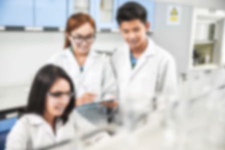 Young laboratory assistant prepare instrument for chemical lab experiment in Labの写真素材