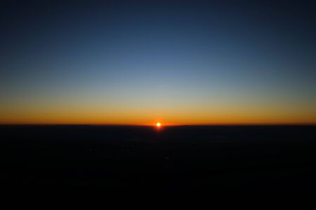 Blur sunset with bokeh sun light wave abstract background. Travel concept. Retro color style.の写真素材