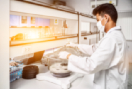 Young laboratory assistant prepare instrument for chemical lab experiment in Labの写真素材