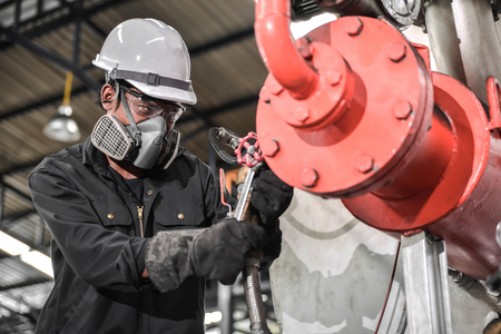 Engineers working in temperature control room of large buildingの写真素材