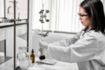 Young laboratory assistant prepare instrument for chemical lab experiment in Labの写真素材