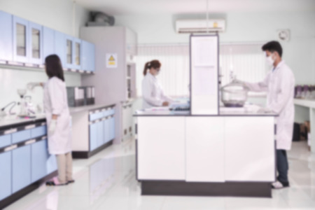 Young laboratory assistant prepare instrument for chemical lab experiment in Labの写真素材