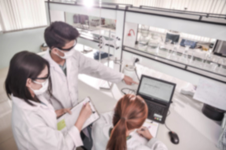 Young laboratory assistant prepare instrument for chemical lab experiment in Labの写真素材