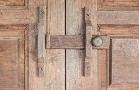 Wooden lock latch on wooden doorsの写真素材