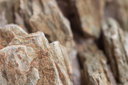 Close-up detail of rough cut miniature rocky cliffs. Nature and adventure concept.の写真素材