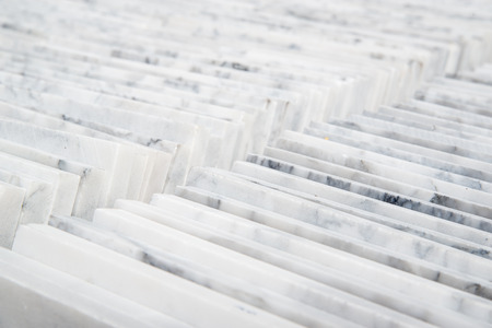 Stacks of high-quality Carrara marble tiles. Home and construction industry concept.の写真素材