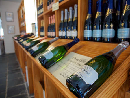 NANSTALLON, ENGLAND - MARCH 4, 2019: Wide closeup of multiple bottles of award-winning sparkling...