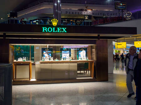 LONDON, ENGLAND - MARCH 8, 2019: Wide closeup of a Rolex authorized dealer at Heathrow International Airport. Travel and Swiss luxury watch industry.のeditorial素材