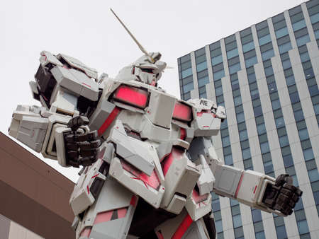 TOKYO, JAPAN - MARCH 30, 2019: Closeup of a life-sized replica of the Unicorn Gundam mecha posed in front of Diver City Plaza. Odaiba, Koto. Travel and Anime.のeditorial素材